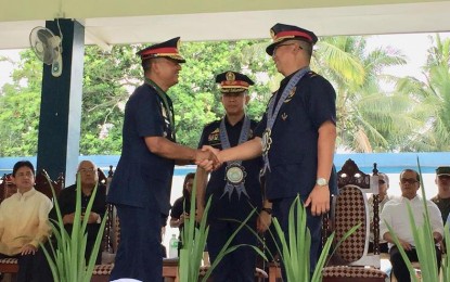 <p><strong>TURNOVER OF COMMAND.</strong> Police Director Rolando Felix, Directorate of Integrated Police Operations (DIPO) for Visayas (center), administers the turnover of command between outgoing Police Regional Office 6 (PRO6)  Director Chief Supt Cesar Hawthorne Binag (left) and incoming Director Chief Supt John C. Bulalacao held at the Camp Martin Delgado on  Tuesday (June 5, 2018.)<em> (Photo by Cindy Ferrer) </em></p>
<p> </p>